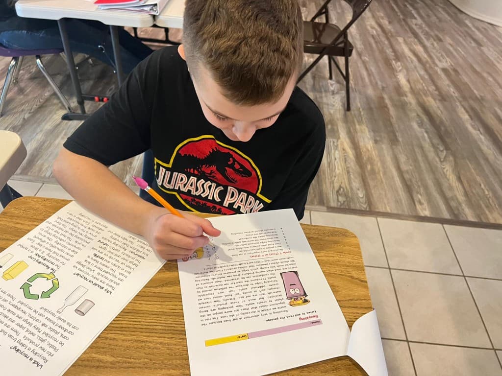 A student focused on independent work at Community Schoolhouse.