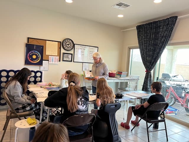 Students listening during a Community Schoolhouse lesson.